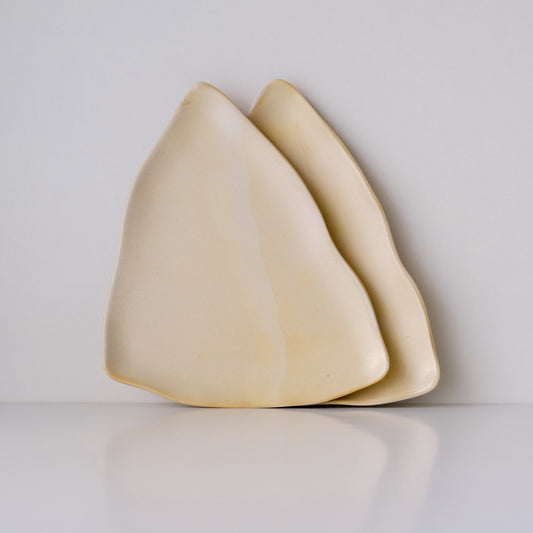 set of two triangular dessert plates in light yellow colour